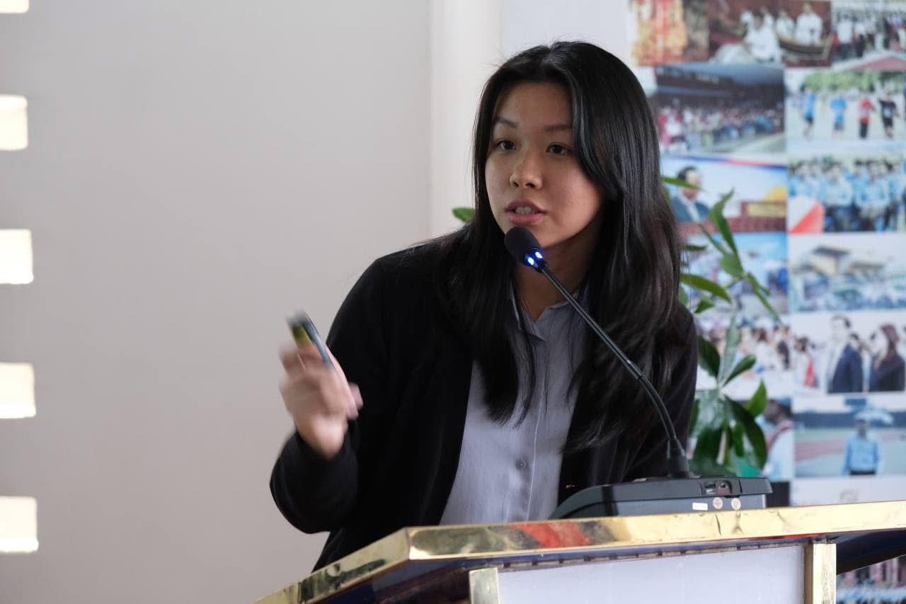 Sethyka Ung speaking at a podium
